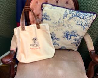 Antique carved wood chair, blue toile pillow, tote bags