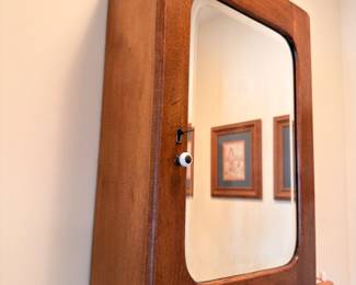 Vintage wooden medicine cabinet with mirror