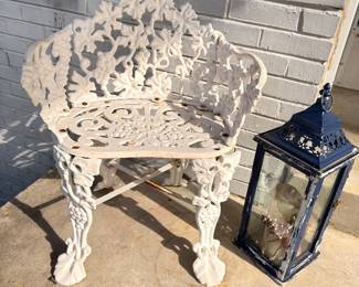White cast iron Victorian garden bench, metal lantern