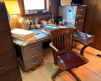 Vintage wood office desk with swivel chair, brass desk lamp