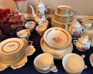 Gold-trimmed floral china set, teapot, cups, plates
