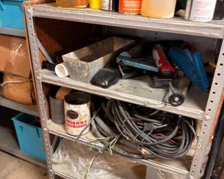Metal shelving, spray paint, extension cords, garage supplies