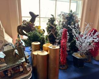 Christmas trees, reindeer figurine, gold pillar candles, holiday decor