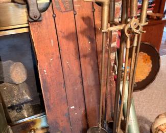 Antique wooden sled, brass duck head fireplace tool set