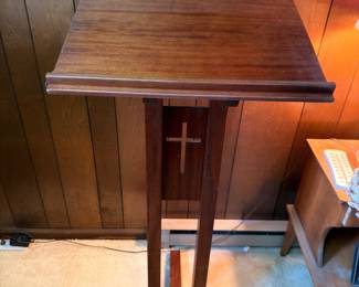 Antique wooden church lectern with cross detail