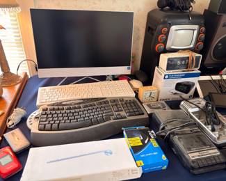 Computer monitor, keyboard, vintage TV, Timex clock radio, electronics