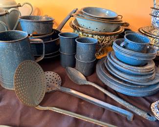 Blue speckled enamelware plates, cups, colander, ladle