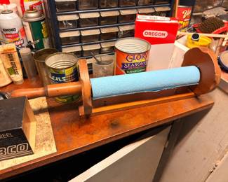 Paint roller, vintage tin cans, workshop supplies