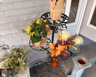 Silk flower arrangements, metal plant stand, wicker basket