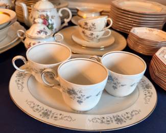 Fine china teacups and platter, blue floral pattern, gold trim