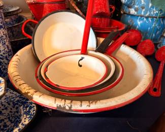 Vintage red and white enamelware bowls, pans, utensils