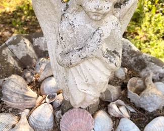 Concrete garden fairy statue, seashell collection