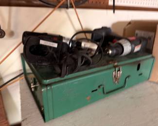 Vintage green metal toolbox with power drills