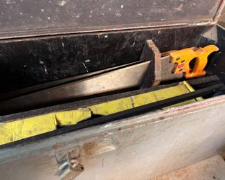 Metal toolbox with hand saw, levels, hand tools