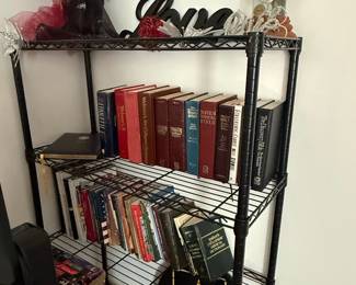 Black Metal Wire Shelving Unit with Books and Decorative Items