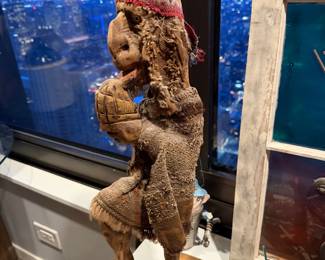 Andean folk art carved from wood, including a rough-woven tunic and a distinctive knit ear-flap hat (ch'ullo), $80 