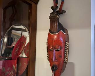 Red hand-carved African tribal mask, identified as a Guro or Baule mask from the Ivory Coast or Ghana region, Price: $480,