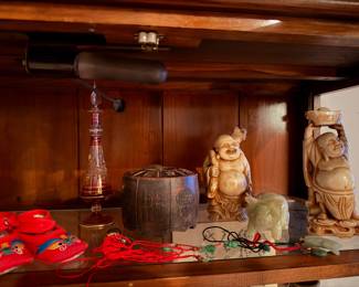 Traditional Red Embroidered Slippers These decorative shoes are adorned with playful and a collectible it intricate embroidery, perhaps as em$25.00 | Center piece: Antique Zisha- Yixing- I-Hsing Tea Caddy  with cover $100 | Porcelain Buddha figures $40 each |  Onyx Marble Carved Pig $30  