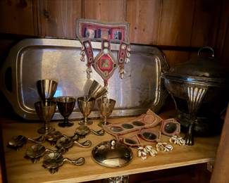 Set of 6 Vintage Silver-Plated Cordial Goblets, w/ flared bowl on a short pedestal base $80 | Silver tray $50 | Antique  silver-plated chafing dish $60 | Red Banjara embroidery panel, likely a "Galla" or protective headpiece  $66  | tribal ceremonial or decorative ornament featuring numerous small cowrie shells $65