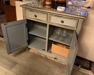 Safavieh Tate 2-Drawer, 2-Door Sideboard, versatile storage unit designed with a mix of farmhouse and coastal aesthetics. Appearance: Pine wood, Distressed Grey, Hardware: It is detailed with simple, dark metal pewter-finished knobs, 29.5" wide x 13.4" deep x 26" high, Condition: Used, Like New, Price $350