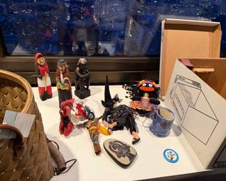 ItemIndividual Estate PriceHand-Carved European Folk Couple (Pair)$55.00 | Traditional Peruvian "Scarecrow" Cloth Doll $25.00 | "Kitchen Witch" Hanging Figure	$15.00| Hand-Painted Stone with Buddha Motif $20.00 | Artisanal Blue Glazed Miniature Mug $20.00 | Carved Ebony-Style "Thinker" Figure Painted Black $40.00  |  