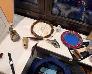 Brown Native American-style dream catcher $50, Buddha Candle Holder: $25.00