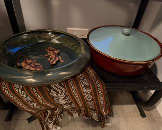 Large artisanal hand-carved ceramic bowl featuring a deep forest green and charcoal mottled glaze $80 | Red Wing Pottery casserole dish in  "Village Green" $60 | Mayan print inspired, Hand woven medium sized textile $45 