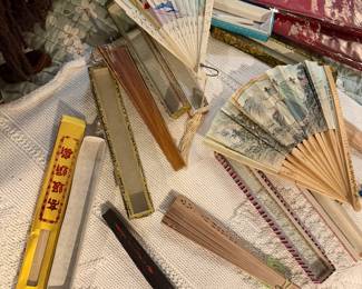Silk, sandalwood, and bamboo  Chinese and Japanese originating fans w/ cases $25 each 