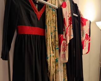 Black crepe or silk dress featuring high-contrast tomato red waist, chest, and bottom lining.  It is adorned with intricate gold metallic thread embroidery and crystal detailing  $150, Yellow and teal Japanese Kimono (Floral) $140, Red & White Patterned Kimono $80  