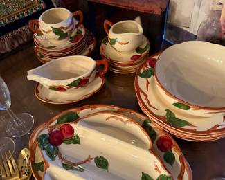 1950s Franciscan Apple Dinnerware Complete Set of Approx.  31 Pieces  $225 ,  1 Large Divided Relish/Serving Dish&nbsp;(Oval) 1 Small Divided Serving Dish&nbsp;(Canoe style) 1 Gravy Boat with Attached/Matching Underplate 1 Lidded Sugar Bowl&nbsp;(Double handled) 1 Creamer Pitcher 8 mugs 1 Double sided Bowl  2 Large Serving/Salad Bowls 5 Dinner Plates&nbsp;(Stacked) 5 Salad/Dessert Plates&nbsp;(Stacked) 5 Bread & Butter Plates/Saucers&nbsp;(Stacked)