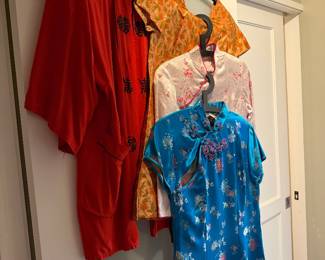 Red Tang suit jacket or Robe $50, Cheongsam / Qipao: The three dresses on The right (yellow, white with floral patterns, and blue) are cheongsams $70 each
