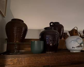 Left to Right: 2 VINTAGE HAEGER POTTERY BLACK RIBBED VASE - 1996 $60 each | Dark Brown Glazed 4 Handle Pot with handles $90 | White Japanese ceramic pot $49 |   Copper teapot, mid 20th century, featuring hand-hammered details  $62  
