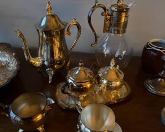 ce features decorative scroll handles, ornate finials, and classic "claw" or "scroll" style feet $275