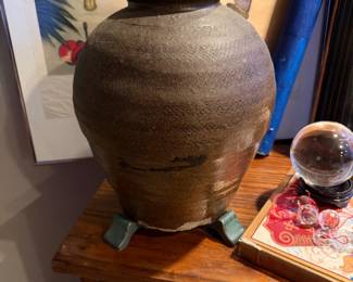 Large Brown Ceramic Vase heavy, wheel-thrown ceramic vessel with a dark brown glaze and teal base pieces $280, visible crack at the bottom