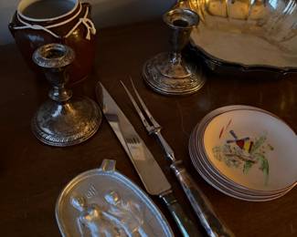 Pair of Weighted Sterling Silver Candle Holders $120 | Stoneware Bean Pot, Brown Glazed Pottery $45 | Vintage Silver-Plated Scalloped Serving Bowl $60 |  Antique 2-Piece Meat Carving Set. Includes a large carving knife and a two-prong meat fork. $80 |  |double-sided aluminum "risque" or novelty ashtray  $75  | vintage silver-plated serving bowl or centerpiece dish $65 | 
