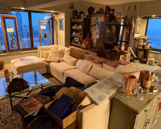 Modular "Cloud-Style" Sectional Sofa with Ottoman, Features a versatile, multi-piece configuration that can be rearranged to fit various room layouts,  Off-White / Ivory Performance Fabric $2,400