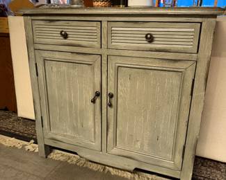 Safavieh Tate 2-Drawer, 2-Door Sideboard, versatile storage unit designed with a mix of farmhouse and coastal aesthetics. Appearance: Pine wood, Distressed Grey, Hardware: It is detailed with simple, dark metal pewter-finished knobs, 29.5" wide x 13.4" deep x 26" high, Condition: Used, Like New, Price $350