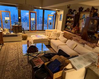 Modular "Cloud-Style" Sectional Sofa with Ottoman, Features a versatile, multi-piece configuration that can be rearranged to fit various room layouts,  Off-White / Ivory Performance Fabric $2,400