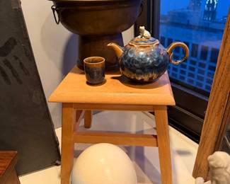 Mongolian hot pot&nbsp;(also known as a Chinese fire pot or steamboat) $150 | Hagi Ware Ceramic Teapot & Cup Set, It includes a teapot and a small matching tea cup, both featuring a striking rustic blue and earth-toned glaze.&nbsp;$60 | Small Natural Wood Step Stool $25 | Hand-Painted Ostrich Egg with Stand $80