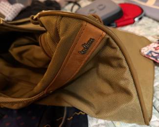 Green ballistic nylon with full-grain brown leather accents and trim $85