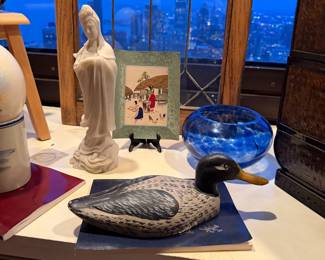 A vintage "Blanc de Chine" (White from China) porcelain figure of Guanyin, the Goddess of Mercy. $185 | Hand-Painted Mallard Duck Decoy $105 | Mid-Century Modern Cobalt blue glass bowl $65 
