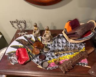 Religious & SpiritualSymbolic  Items:Silver Menorah: A traditional Jewish candelabrum used for Hanukkah, featuring a Star of David motif and ornate branch details $80,  Seated Buddha Candle holders set of 2 $50, Wood carved Chinese Flute Hand Carved Wooden Classical Dog Head Flute $60, Wallet Assortment, $25each, Vintage-style red leather coin purse $25, "NEW YORK" 3-D Laser Etched Crystal Paperweights $30 