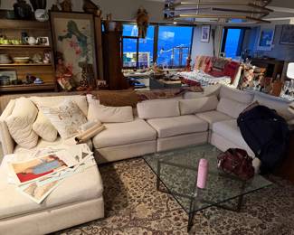 Modular "Cloud-Style" Sectional Sofa with Ottoman, Features a versatile, multi-piece configuration that can be rearranged to fit various room layouts,  Off-White / Ivory Performance Fabric $2,400