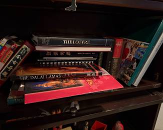 Assorted books $30-80 each featuring The Louvre" (Hardcover, Scala Books): A comprehensive art history volume featuring the masterpieces of the world-renowned museum. Price: $50.00 | he Dalai Lamas of Tibet" (Heian Publishing): A historical and spiritual exploration of the Tibetan lineage, featuring high-quality photography. Price: $30.00 |  Museums of Europe" (Teubner/Various): A tall, slender guide to the architectural and cultural landmarks across the European continent. Price: $35.00 | Collection of Chinese & Japanese Language Texts: A group of six assorted softcover and hardcover books in various non-English scripts, covering classical literature and contemporary topics. Price: $80.00  