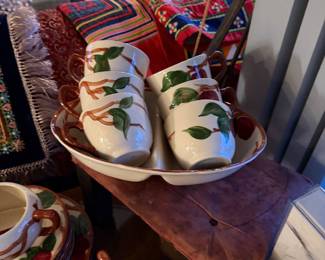 1950s Franciscan Apple Dinnerware Complete Set of Approx.  31 Pieces  $225 ,  1 Large Divided Relish/Serving Dish&nbsp;(Oval) 1 Small Divided Serving Dish&nbsp;(Canoe style) 1 Gravy Boat with Attached/Matching Underplate 1 Lidded Sugar Bowl&nbsp;(Double handled) 1 Creamer Pitcher 8 mugs 1 Double sided Bowl  2 Large Serving/Salad Bowls 5 Dinner Plates&nbsp;(Stacked) 5 Salad/Dessert Plates&nbsp;(Stacked) 5 Bread & Butter Plates/Saucers&nbsp;(Stacked)