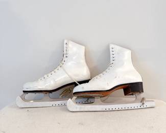 pair of white riedell figure skates