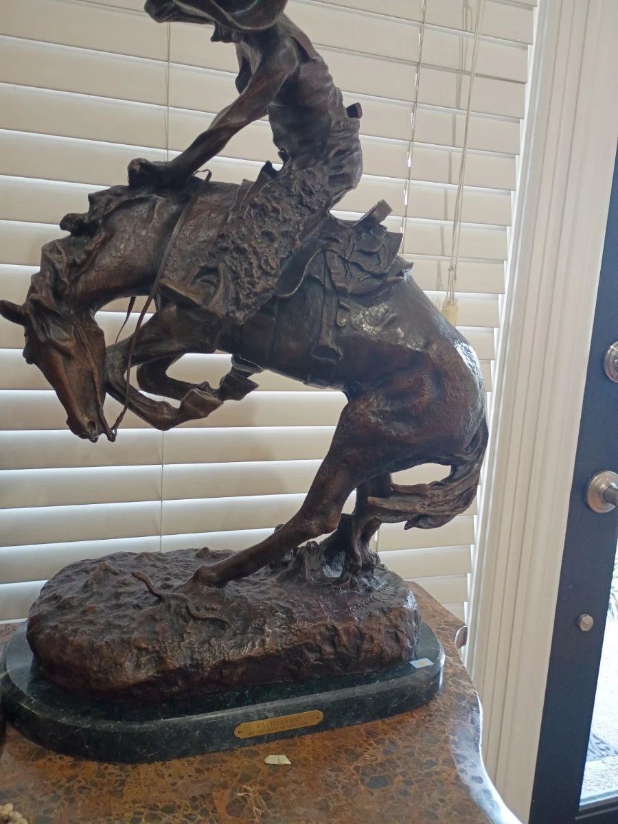 Bronze Remington-style bucking bronco horse sculpture