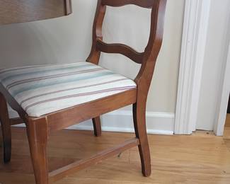 Wood dining chair with upholstered striped seat, ribbon-back style
