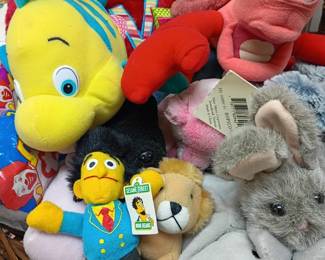 Stuffed animal collection in basket, Tweety Bird plush toys, vintage characters