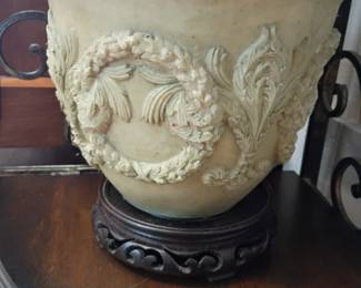 Large decorative planter urn with acanthus leaf relief on stand